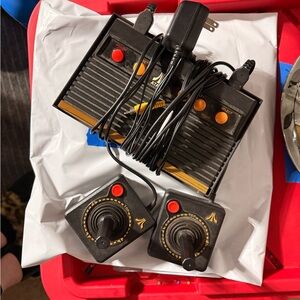 Atari Black and Gold Gaming Console with Controllers